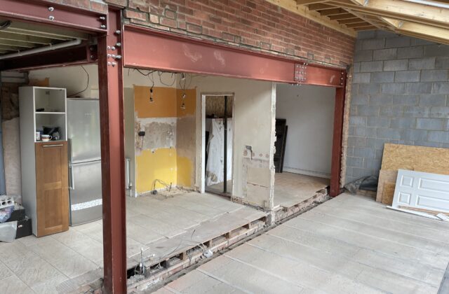 Structural steel beams supporting the rear of the house during the Cherry Hinton extension build in Cambridge