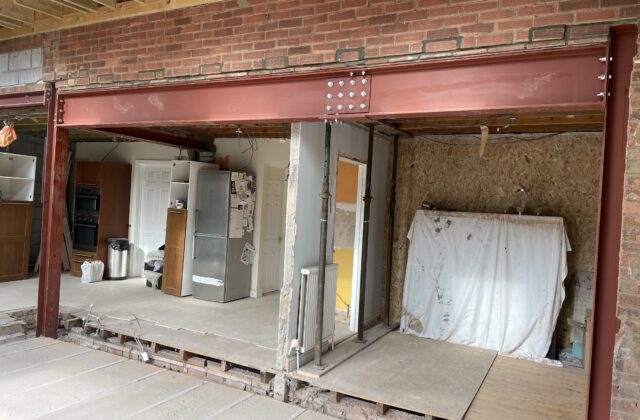 Bolted steel beam and column arrangement holding the original rear wall during the Cherry Hinton extension in Cambridge