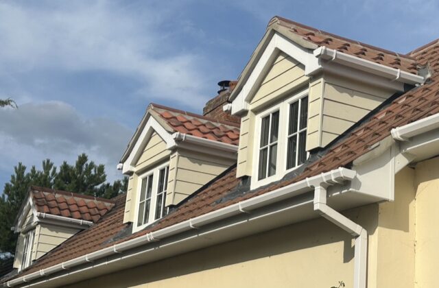 Three pitched gabled dormers in Newmarket with farmhouse pantiles, hardie board cladding, white fascia boards and lead flashing